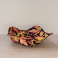 Brilliant orange red and gold leaves on a black background bowl cozy