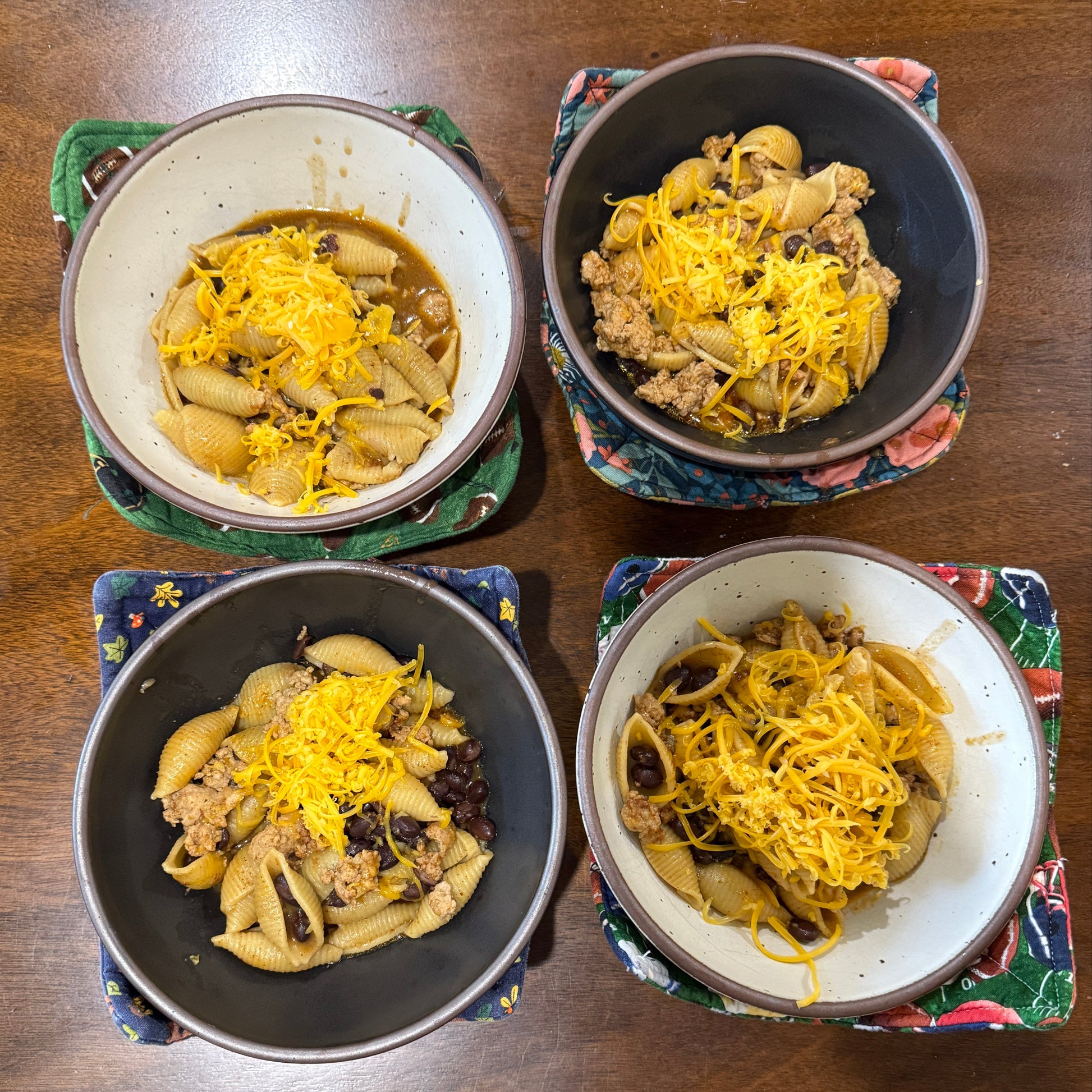 Four East Fork Bowl nestled inside 4 variants of Bowl Cozies